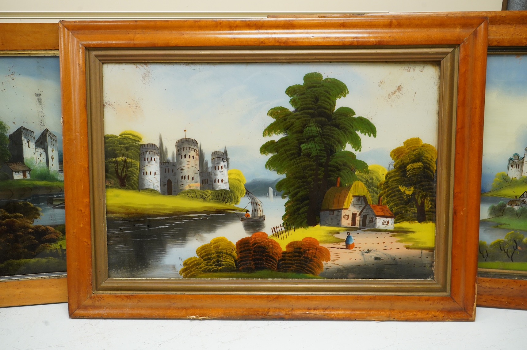 Victorian School, four reverse glass painted panels, Riverscapes, largest 39 x 60cm